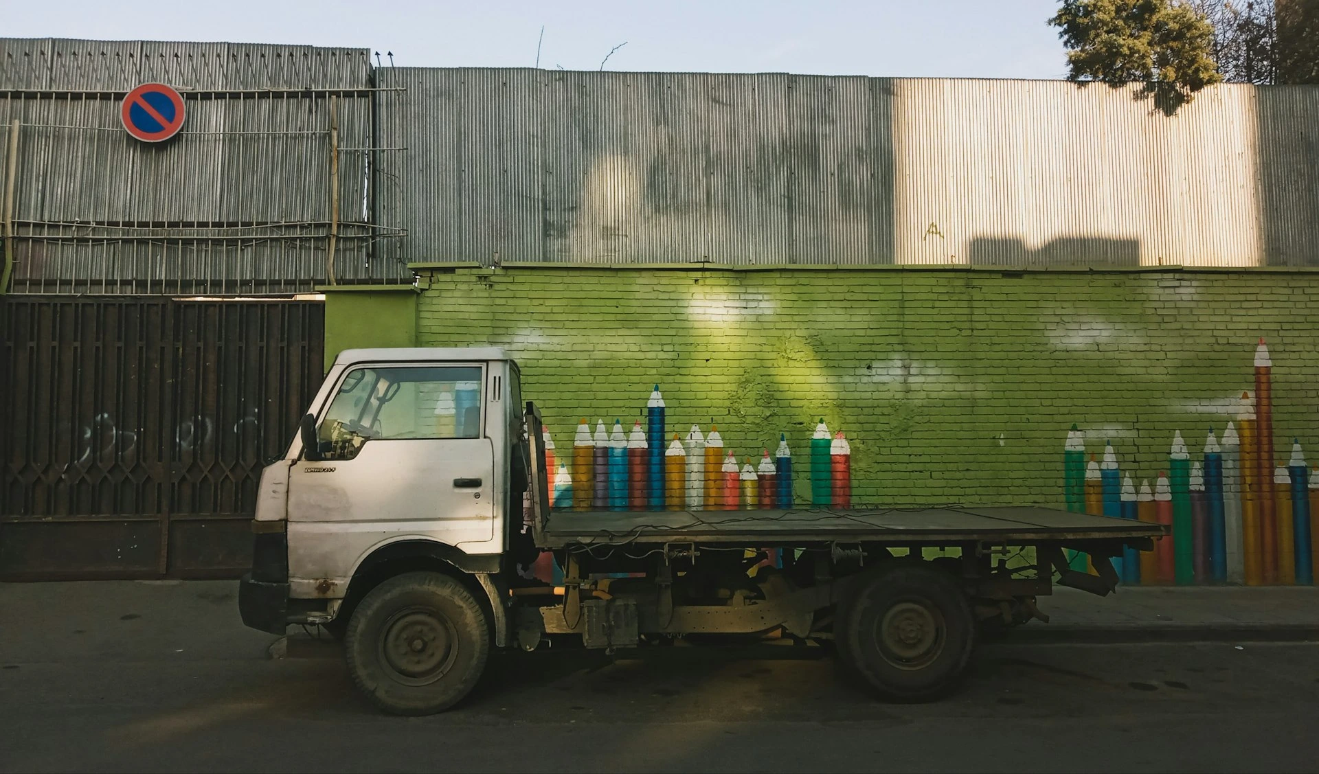 white and blue truck on road during daytime